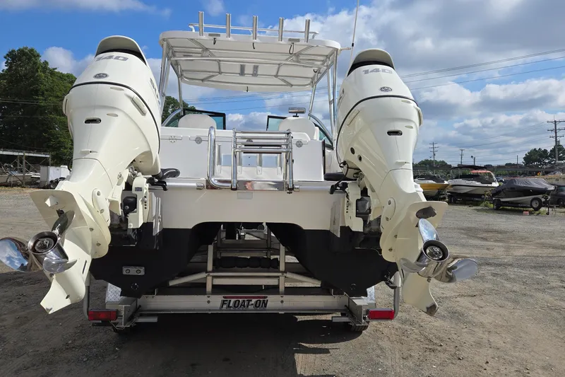 Slide: The Image of 2020 Twin Vee 240 DC GF boat with dual outboard motors on a trailer. - 5