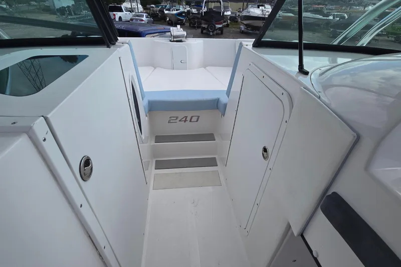 Slide: The Image of 2020 Twin Vee 240 DC GF boat interior with seating and storage compartments. - 52