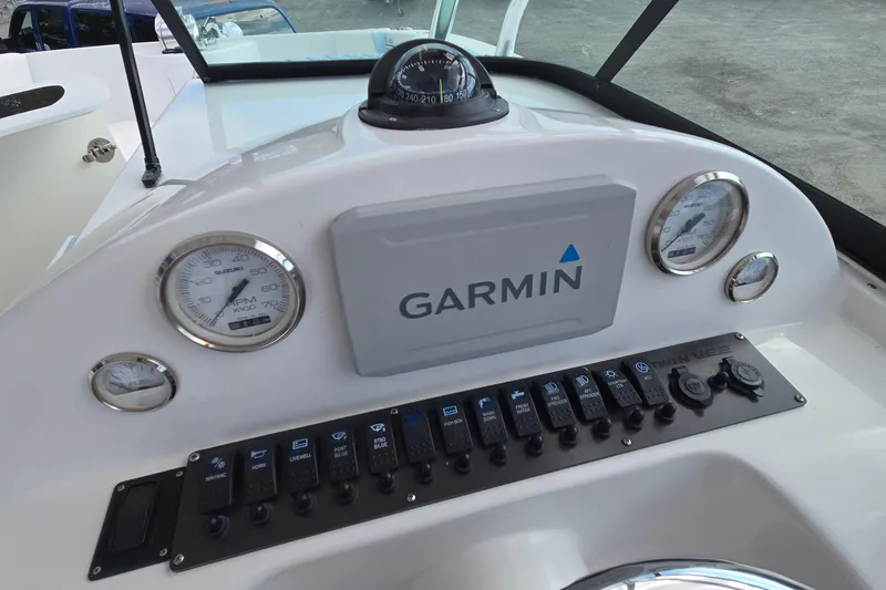 Slide: The Image of Dashboard of 2020 Twin Vee 240 DC GF boat with Garmin navigation system. - 53