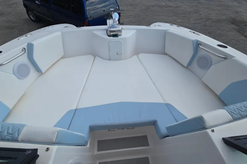 Slide: The Image of 2020 Twin Vee 240 DC GF boat interior with white and blue seating. - 58