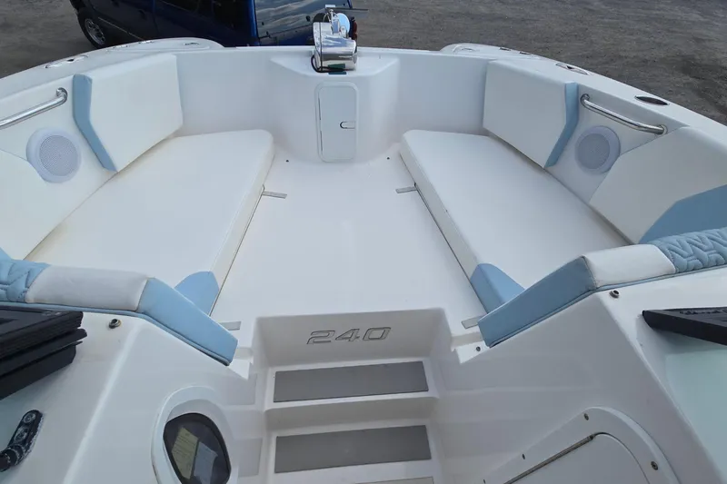 Slide: The Image of 2020 Twin Vee 240 DC GF boat interior with white and blue seating. - 59