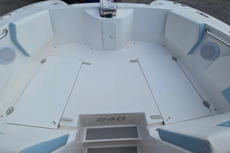 Slide: The Image of 2020 Twin Vee 240 DC GF boat interior with seating and storage compartments. - 63