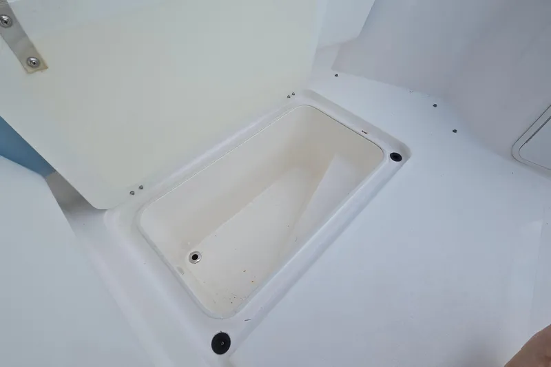 Slide: The Image of Storage compartment on a 2020 Twin Vee 240 DC GF boat, open and empty. - 64