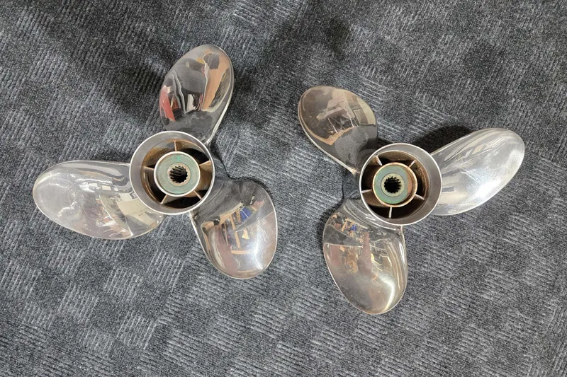 Slide: The Image of Twin Vee 240 DC GF 2020 boat propellers on gray carpet. - 77