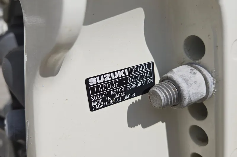 Slide: The Image of Close-up of Suzuki DF140A engine label on 2020 Twin Vee 240 DC GF boat. - 81