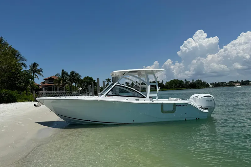 Slide: The Image of 2024 Sea Fox 268 Traveler boat on a sunny beach with clear skies. - 0