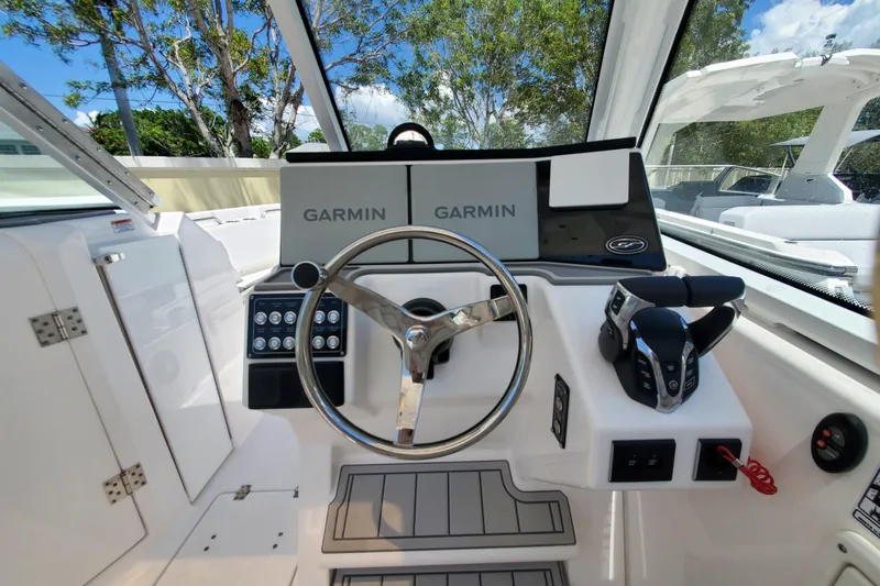 Slide: The Image of 2024 Sea Fox 268 Traveler boat helm with Garmin navigation system and modern controls. - 12