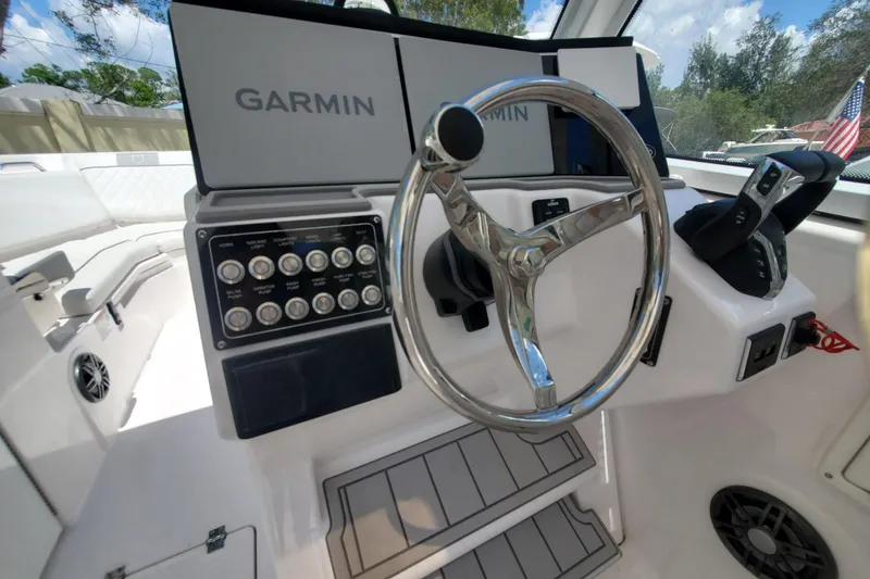Slide: The Image of 2024 Sea Fox 268 Traveler helm with Garmin displays and control panel. - 15