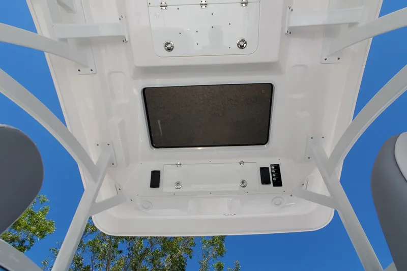 Slide: The Image of 2024 Sea Fox 268 Traveler boat roof with hatch, viewed from below against blue sky. - 21