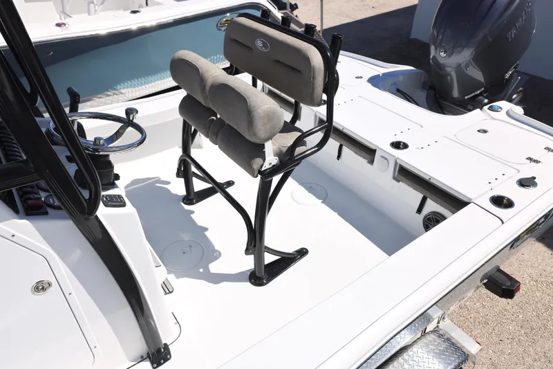 Slide: The Image of 2026 Sea Hunt BX 22 BR boat interior with seating and steering wheel. - 12