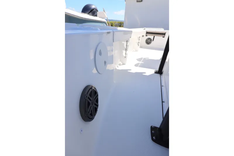 Slide: The Image of 2026 Sea Hunt BX 22 BR boat interior, featuring sleek white design and modern speaker system. - 16