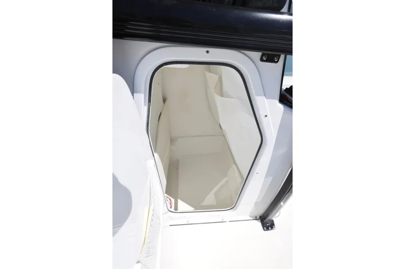 Slide: The Image of 2026 Sea Hunt BX 22 BR boat storage compartment, open door view. - 20