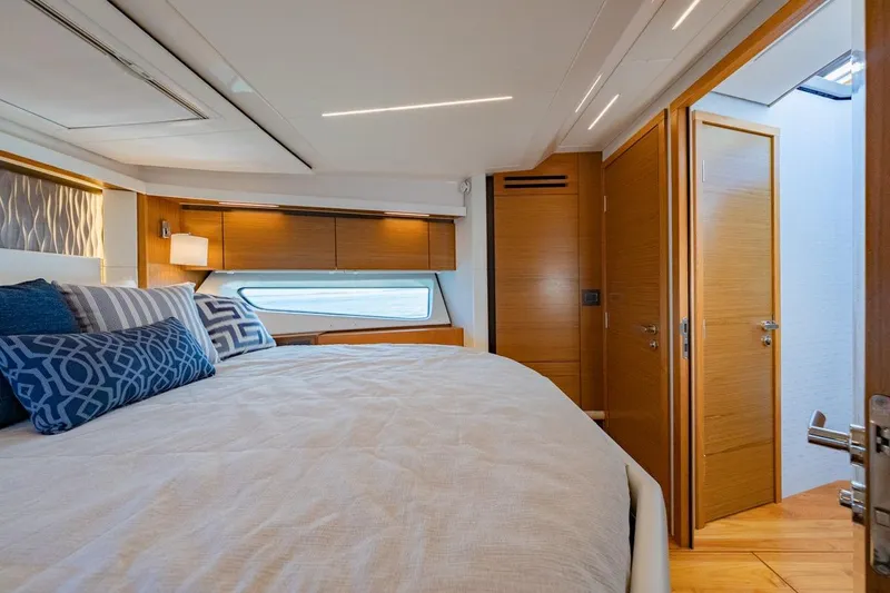 Slide: The Image of Luxurious 2022 Tiara Yachts Coupe bedroom with modern design and elegant wood finishes. - 10