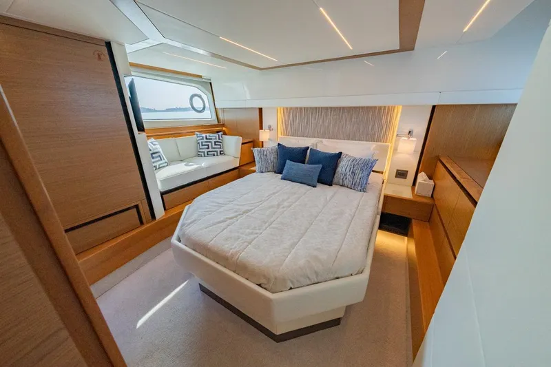 Slide: The Image of Luxurious 2022 Tiara Yachts Coupe bedroom with modern design and elegant furnishings. - 14