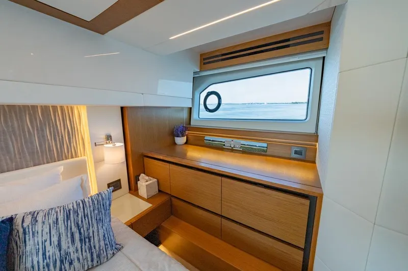 Slide: The Image of Luxurious interior of 2022 Tiara Yachts Coupe with elegant wood finish and ocean view. - 16