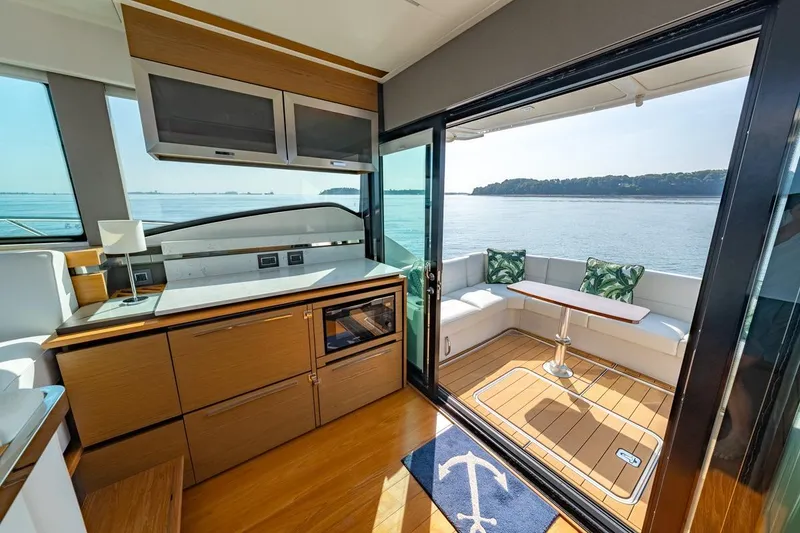 Slide: The Image of Luxurious interior of 2022 Tiara Yachts Coupe with scenic ocean view. - 2