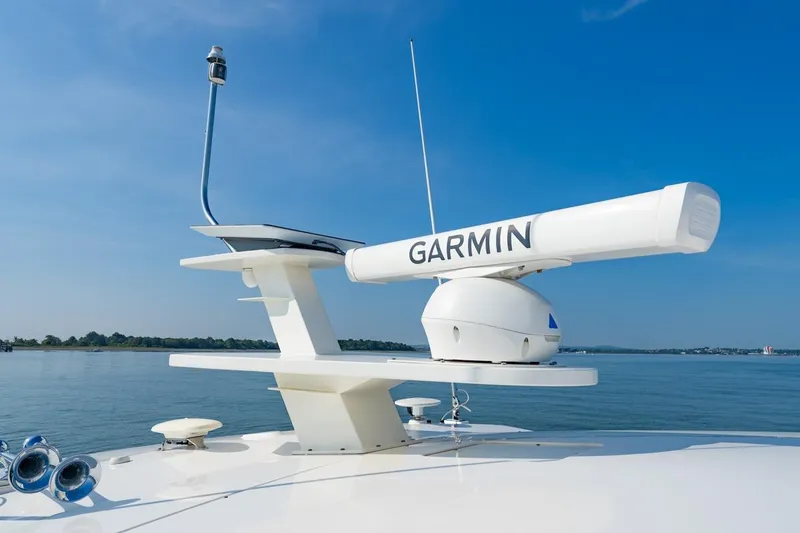 Slide: The Image of 2022 Tiara Yachts Coupe with Garmin radar on calm water. - 27