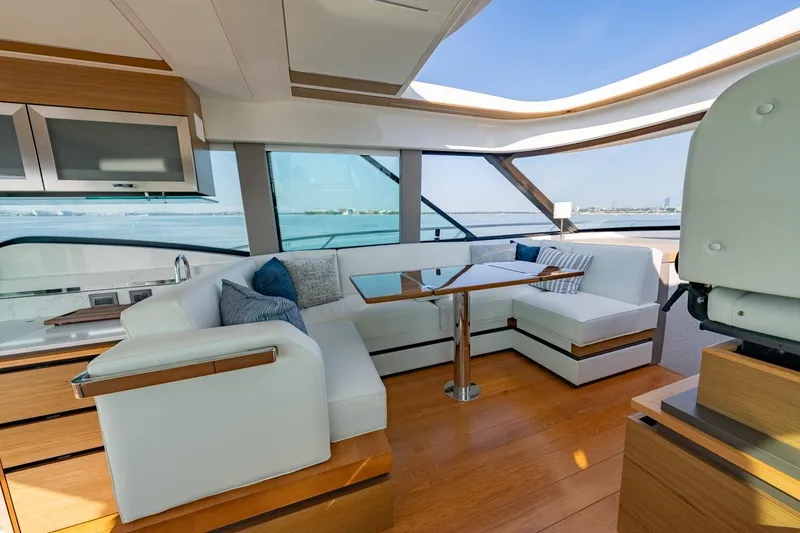 Slide: The Image of Luxurious interior of 2022 Tiara Yachts Coupe with elegant seating and panoramic windows. - 3