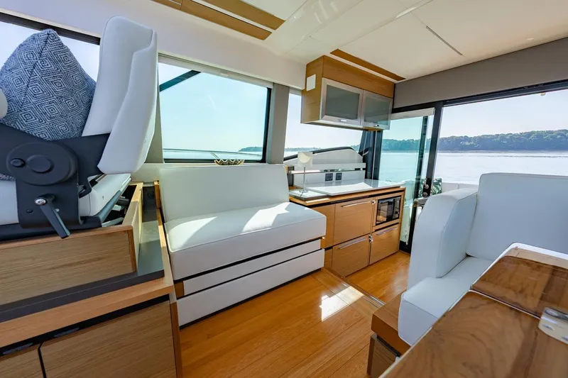 Slide: The Image of Luxurious interior of 2022 Tiara Yachts Coupe with modern furnishings and scenic water view. - 5