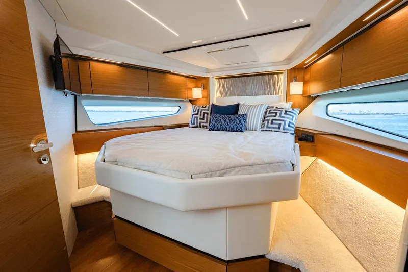Slide: The Image of Luxurious 2022 Tiara Yachts Coupe bedroom interior with modern design and elegant furnishings. - 8