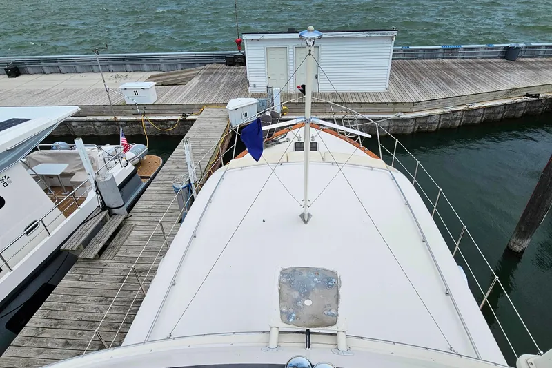 Slide: The Image of 1978 Chris-Craft 410 Commander docked at a marina, view from the deck. - 11