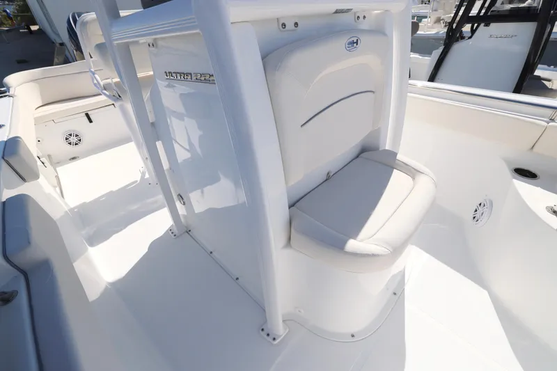 Slide: The Image of 2026 Sea Hunt Ultra 229 boat interior with white seating and console. - 13