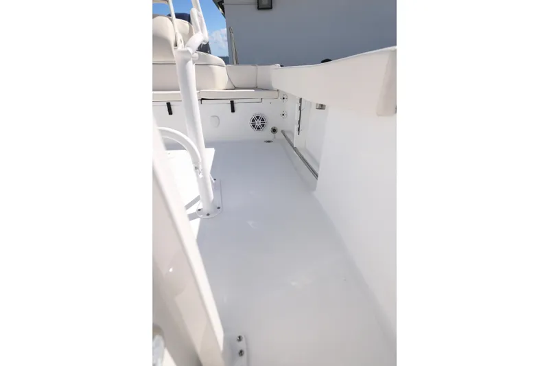 Slide: The Image of 2026 Sea Hunt Ultra 229 boat interior, featuring white seating and clean deck design. - 17