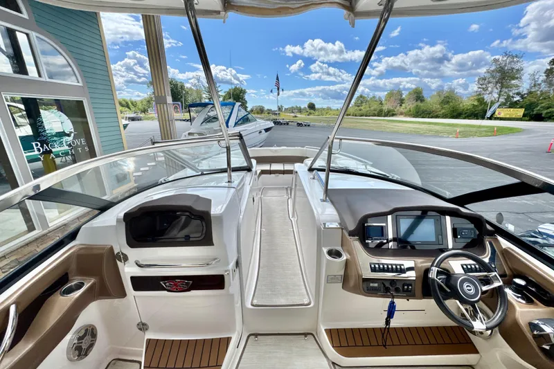 Slide: The Image of 2017 Chaparral 337 SSX boat interior with modern dashboard and steering wheel. - 12