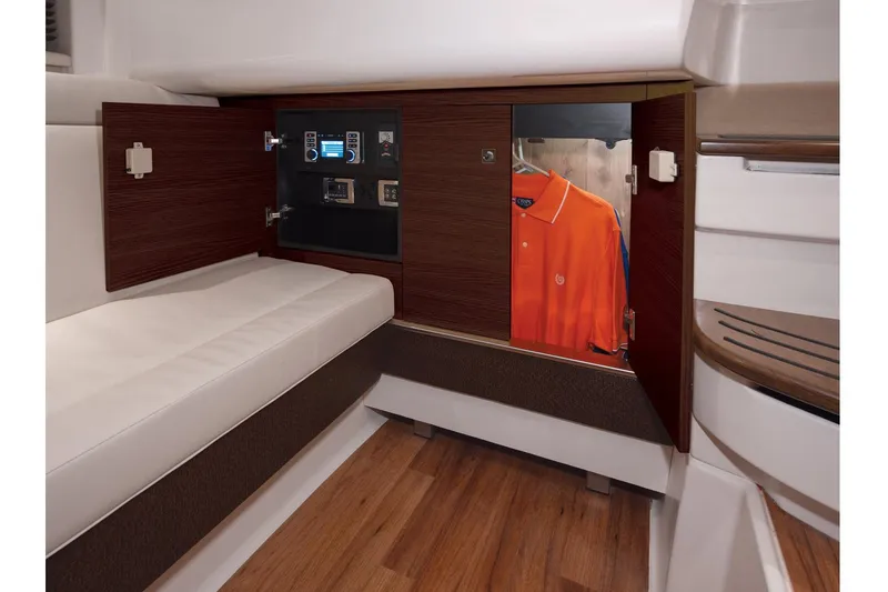 Slide: The Image of Manufacturer Provided Image: Interior cabin of 2017 Chaparral 337 SSX with wooden cabinetry and seating. - 25