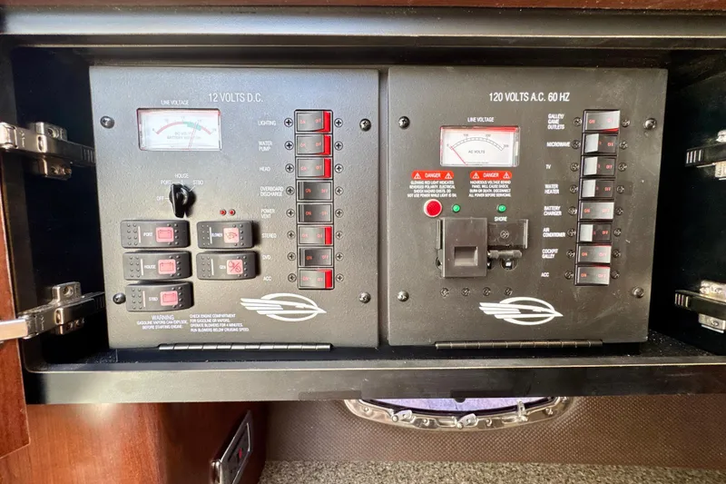 Slide: The Image of Electrical control panel of a 2017 Chaparral 337 SSX boat, featuring switches and meters. - 28