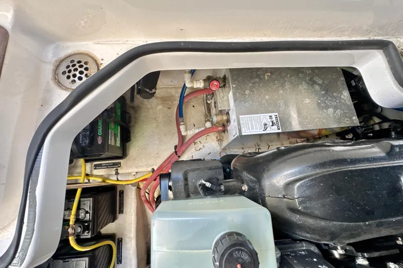 Slide: The Image of Engine compartment of a 2017 Chaparral 337 SSX boat, showing batteries and wiring. - 35