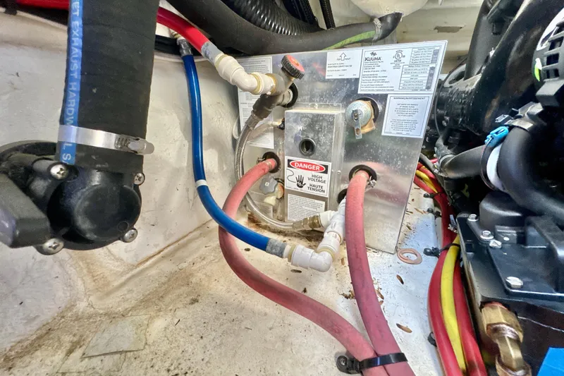 Slide: The Image of Engine compartment of 2017 Chaparral 337 SSX with wiring and warning labels. - 36