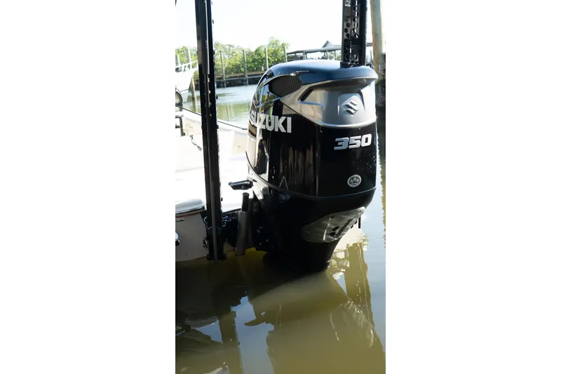 Slide: The Image of 2021 Sea Chaser 26 LX with Suzuki 350 outboard motor in water. - 13