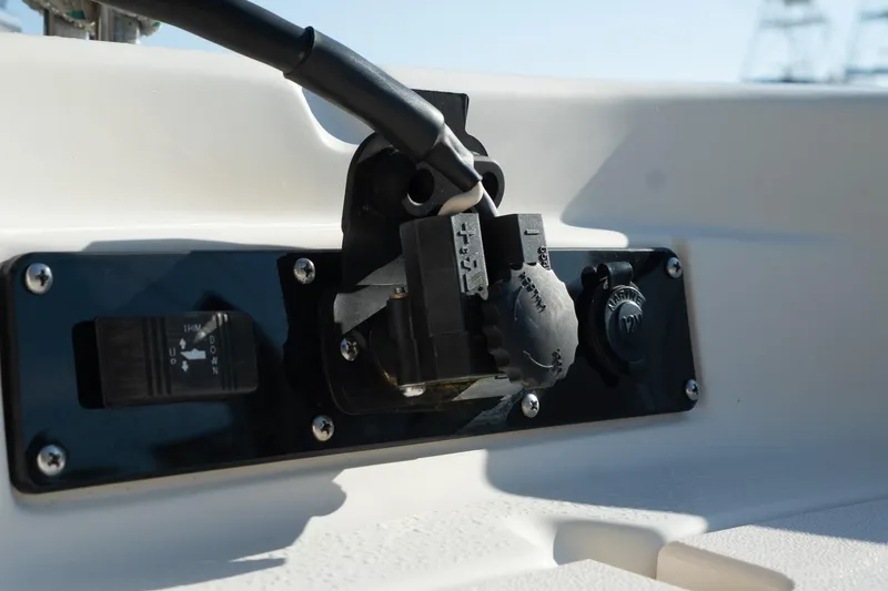 Slide: The Image of Close-up of 2021 Sea Chaser 26 LX boat control panel with switches and connectors. - 17