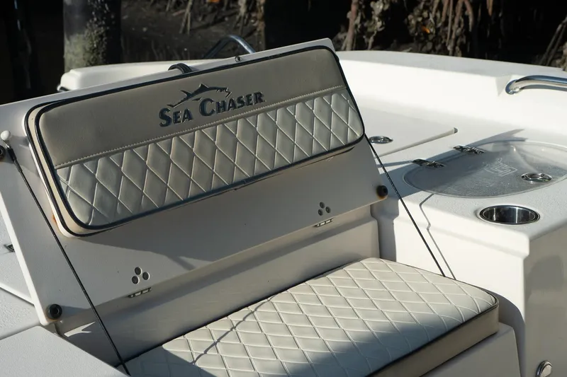 Slide: The Image of 2021 Sea Chaser 26 LX boat seat with diamond stitching and logo detail. - 21