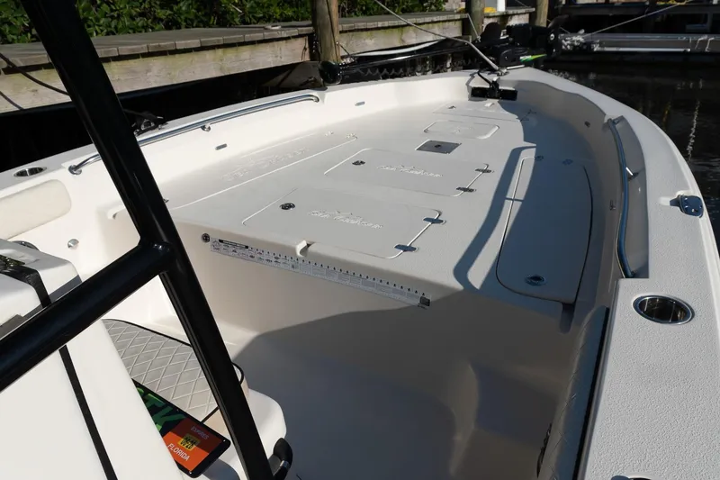 Slide: The Image of 2021 Sea Chaser 26 LX boat interior with spacious deck and storage compartments. - 23
