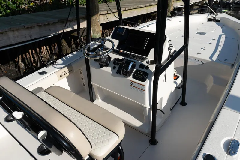 Slide: The Image of 2021 Sea Chaser 26 LX boat interior with steering console and seating. - 24