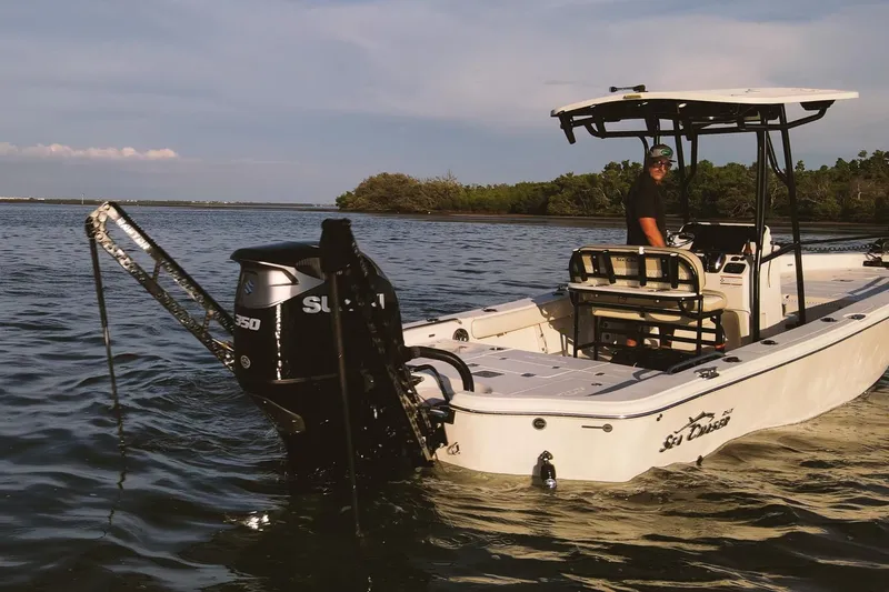Slide: The Image of 2021 Sea Chaser 26 LX boat on water, featuring Suzuki engine, with driver onboard. - 3