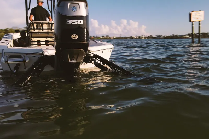 Slide: The Image of 2021 Sea Chaser 26 LX boat with Suzuki 350 engine on calm water. - 4