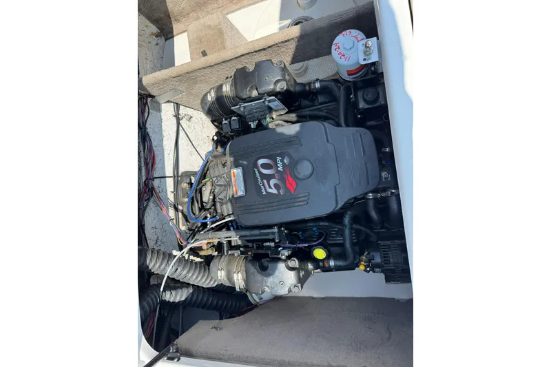 Slide: The Image of 2006 Ebbtide 2100 Bow Rider engine compartment with MerCruiser 5.0 MPI motor. - 12