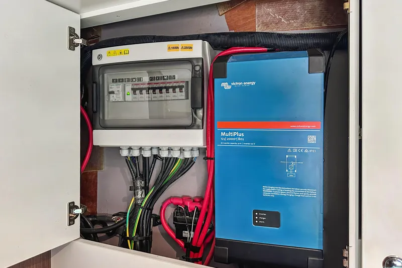 Slide: The Image of Electrical panel and Victron Energy MultiPlus inverter in a Bali 4.2, 2023 model. - 101