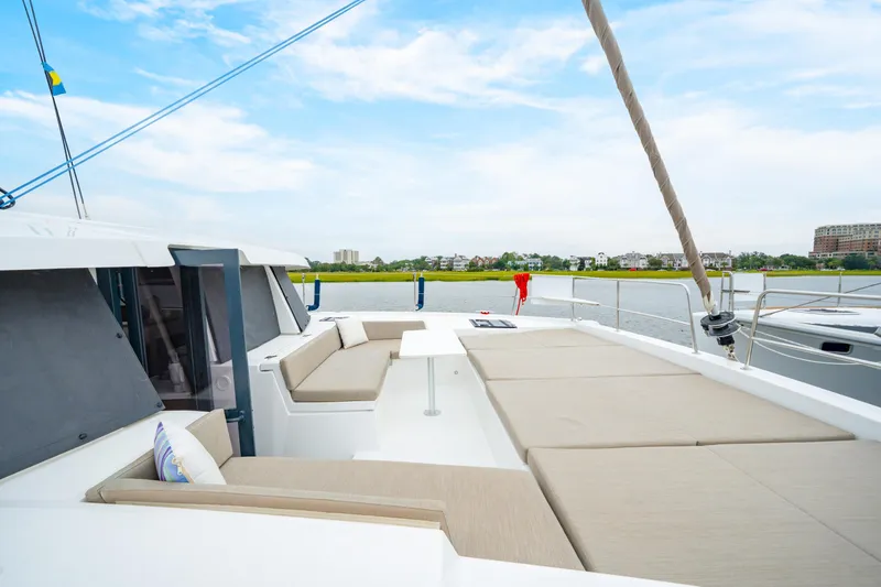 Slide: The Image of Luxurious 2023 Bali 4.2 catamaran with spacious deck and comfortable seating by the water. - 22