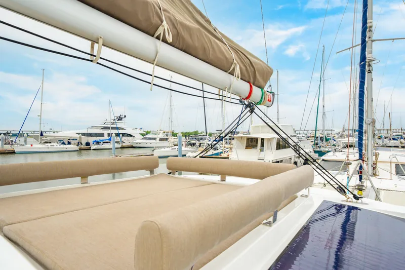 Slide: The Image of Modern 2023 Bali 4.2 yacht in marina, featuring spacious deck and luxurious seating. - 27