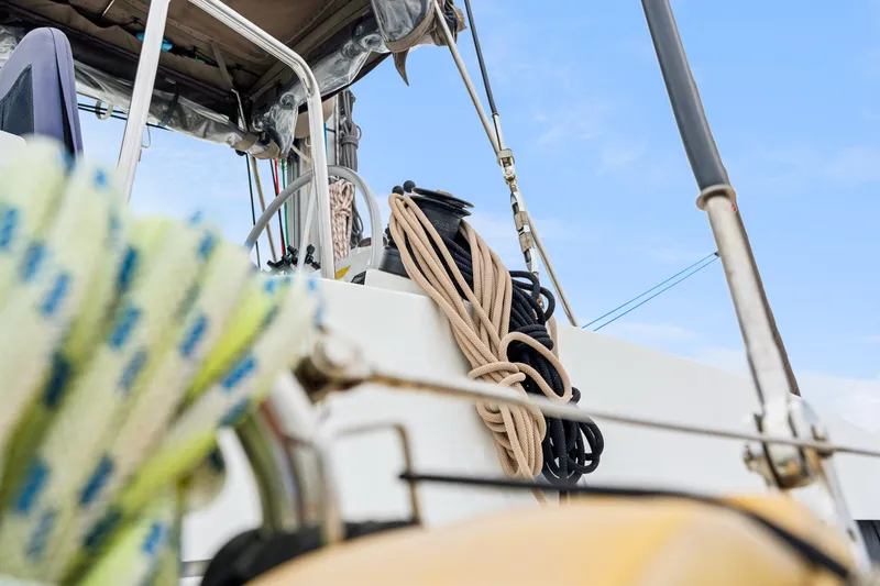 Slide: The Image of Close-up of ropes on a 2023 Bali 4.2 sailboat deck against a clear sky. - 28