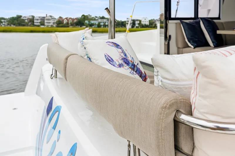 Slide: The Image of Luxurious Bali 4.2 yacht interior with decorative pillows, showcasing comfort and style, 2023 model. - 29