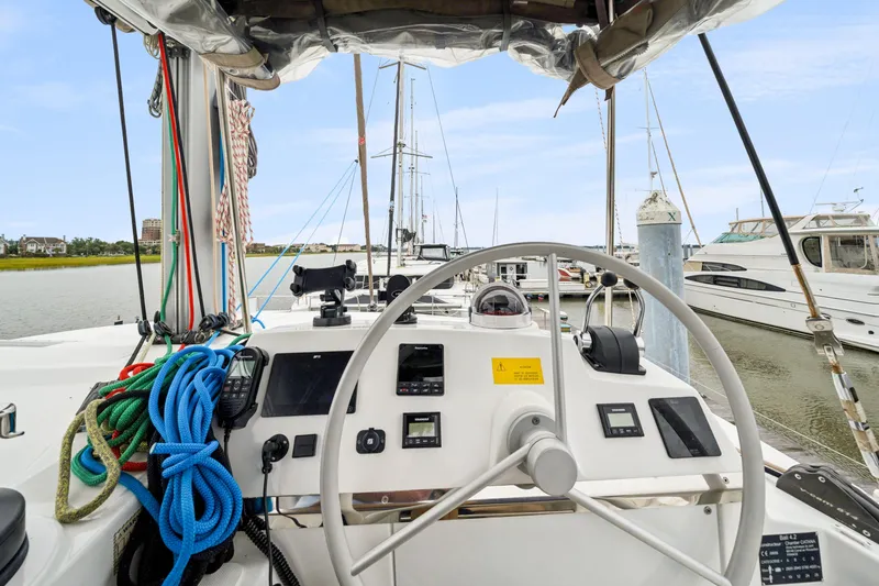 Slide: The Image of Cockpit view of 2023 Bali 4.2 yacht with navigation equipment and colorful ropes. - 31