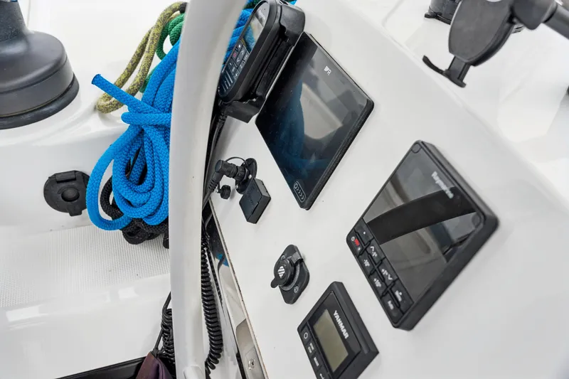 Slide: The Image of Control panel of 2023 Bali 4.2 boat with navigation equipment and blue ropes. - 38