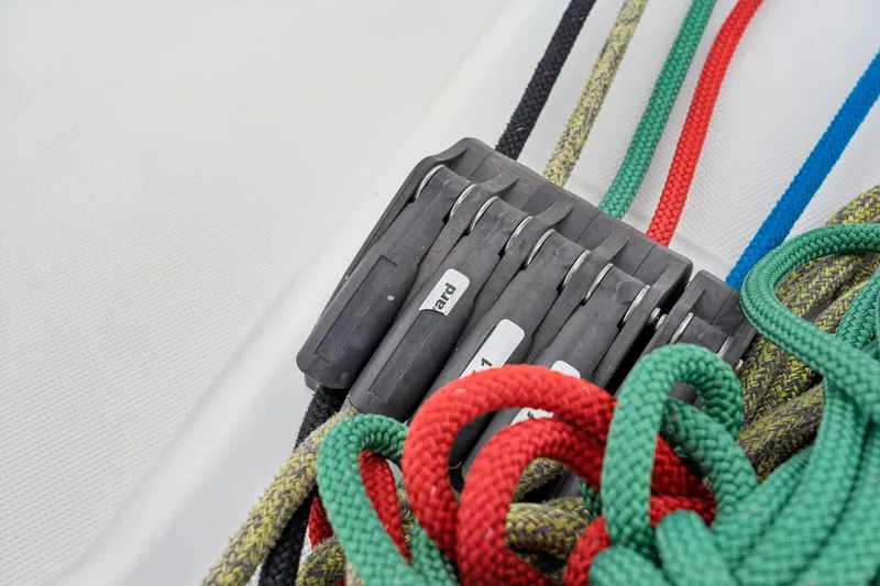 Slide: The Image of Colorful ropes and cleats on a 2023 Bali 4.2 sailboat deck. - 40