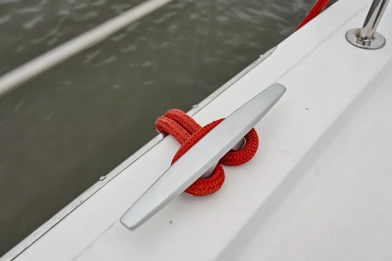 Slide: The Image of Red rope tied to cleat on Bali 4.2 boat, 2023 model. - 43