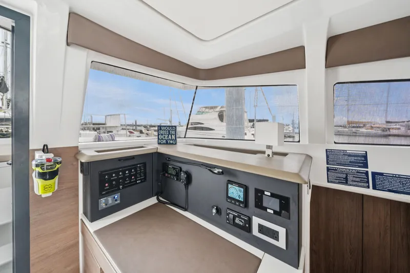 Slide: The Image of Interior of 2023 Bali 4.2 yacht with control panel and marina view. - 48